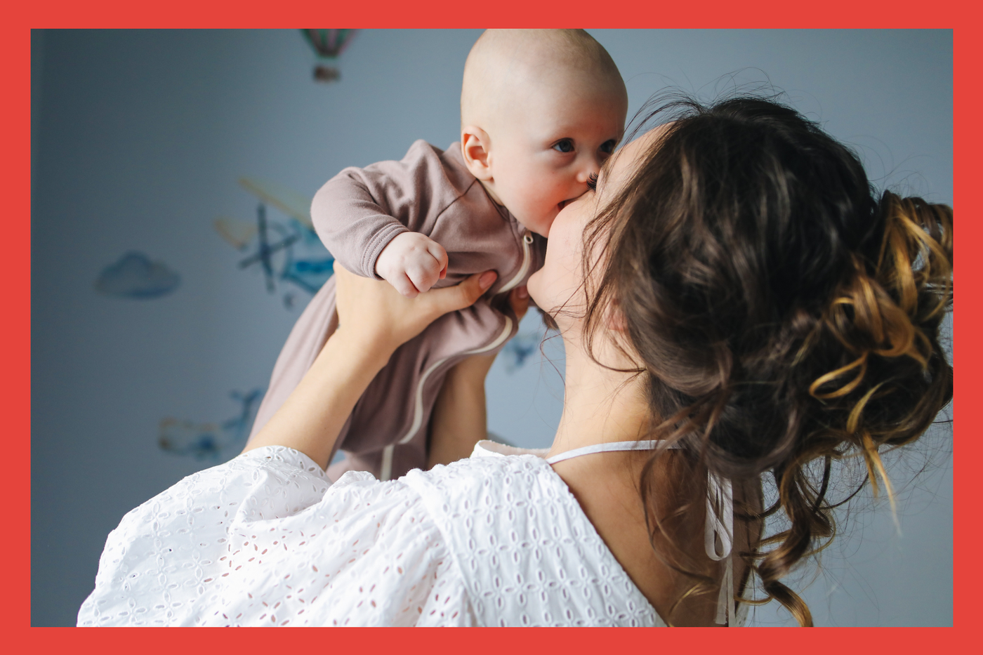 Mother with baby. Kissing and bonding